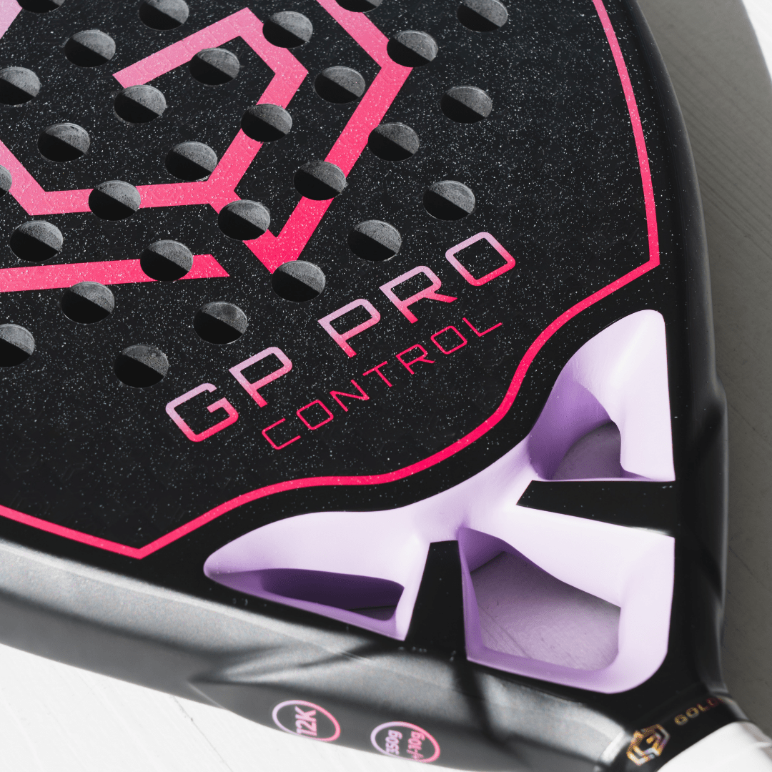 Close-up of the pink GP Pro Control logo and throat on the Golden Padel racket