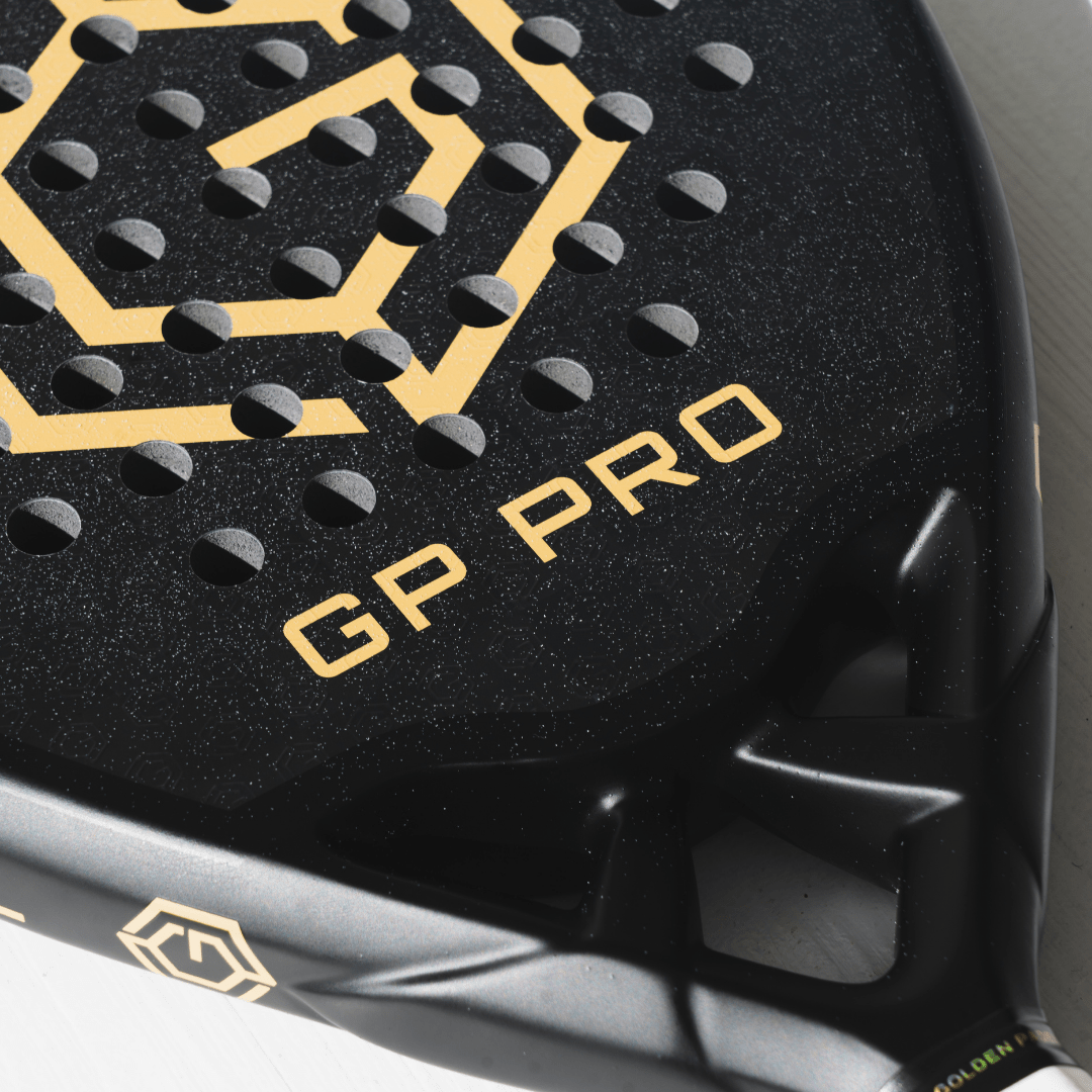 Close-up of the gold GP Pro logo on the Golden Padel racket face