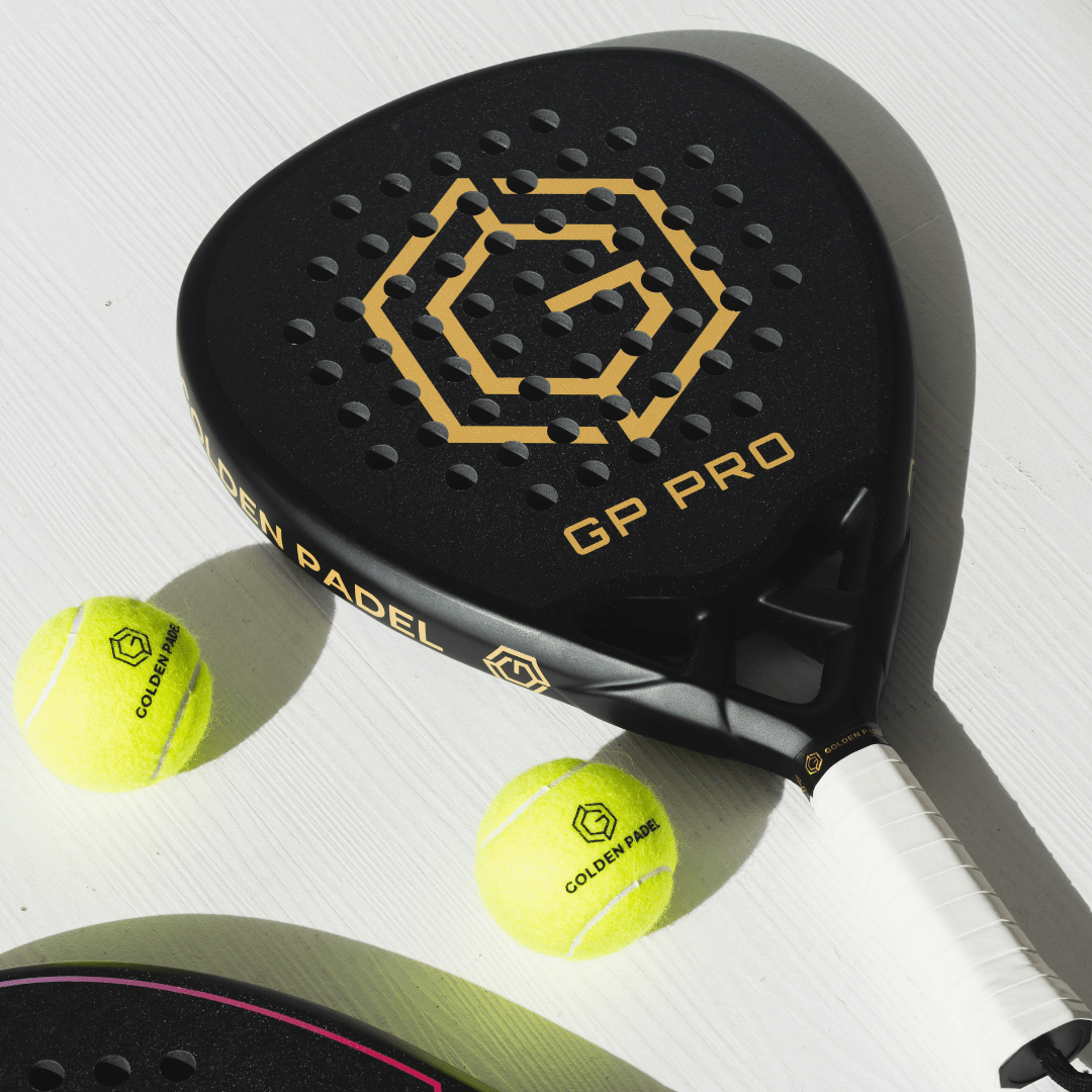 Golden Padel GP Pro racket lying with two padel balls