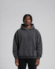 Model wearing the Third Shot heavyweight hoodie in washed charcoal, front view