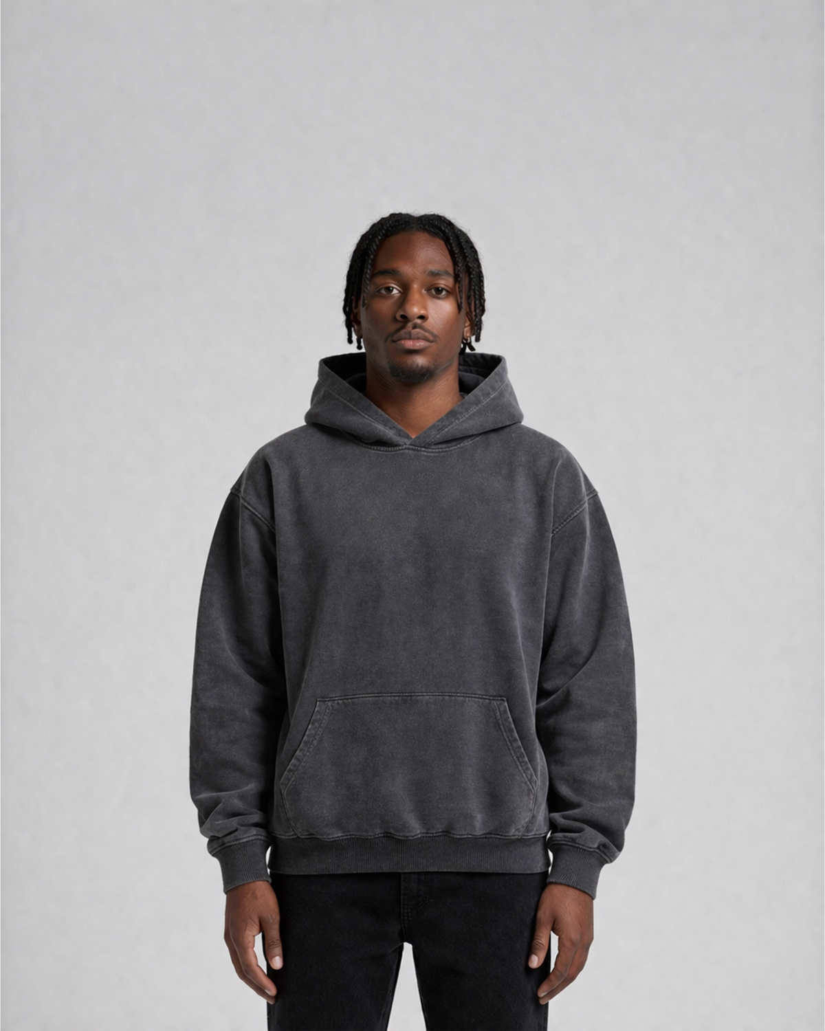 Model wearing the Third Shot heavyweight hoodie in washed charcoal, front view